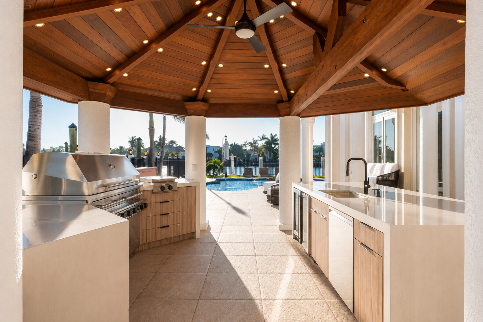 Covered outdoor kitchen with timber ceiling and stone counters